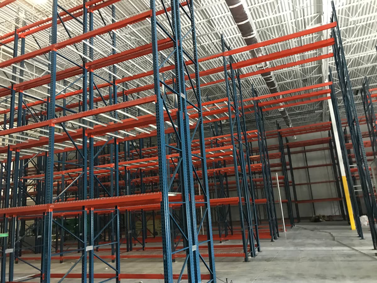Pallet rack installation reaching the ceiling of a distribution center